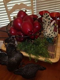 Decorative roosters, tray, and apples