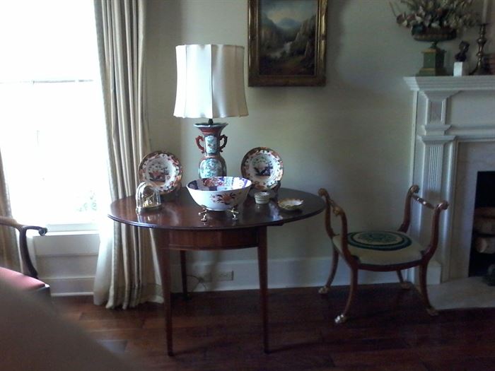 Drop leaf table with oriental lamp and bowls