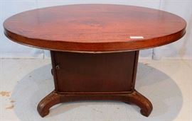 091a  Mahogany oval center table with storage compartment in base, 28 in. T, 51 in. W, 42 in. D.