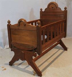 169a  Walnut Victorian rocking baby bed, 37.5 in. T, 39 in. L, 20.5 in. D.