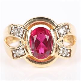 14K Yellow Gold Ruby and Diamond Ring: A 14K yellow gold ruby and 0.15 ctw diamond ring.