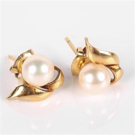 14K Yellow Gold and Cultured Pearl Earrings: A pair of 14K yellow gold and cultured pearl stud earrings.