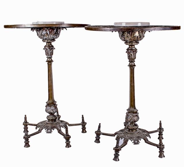 Vintage Empire Style Bronze and Marble Plant Stands: A pair of vintage Empire style bronze and marble table stands. These tables would have been used for displaying sculptures or plants. Embellished with an open-work dandelion, leaf and crest design; and a center circular, white marble surface.