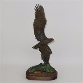 William Hald "Windswept" Bronze Sculpture Signed and Numbered: A stunning 1985 bronze sculpture by famed American wildlife and bird sculptor William Hald (1948) titled _Windswept" Eagle Challenge America’s Cup. It depicts an American Eagle, wings spread, atop a rock and resting on an oval wooden base. This piece is sculptor signed and numbered 25/250.