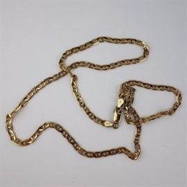 14K Yellow Gold Link Necklace: A 14K yellow gold necklace with woven links and fastens with a lobster claw clasp.