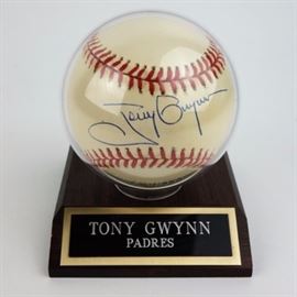 Signed Tony Gwynn Baseball COA: An autographed baseball from Hall of Fame right fielder (inducted 2007) Tony Gwynn of the San Diego Padres. This Rawlings official Major League baseball is signed on the ‘sweet spot,’ in blue ink. The ball has a cushioned cork center. It comes with a COA from South Bay Baseball Cards, Inc., and clear plastic case.