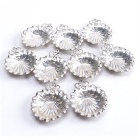 Gorham Sterling Silver Leaf Style Nut Dishes: A group of nine sterling nut dishes in the 5B pattern by Gorham. These round leaf-shaped bowls feature scalloped edges and interlocking vine style accents. The total approximate weight is 8.000 ozt.