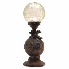 1930s Will Rogers and Wiley Post Lamp: A late 1930s commemorative lamp that honors Will Rogers and Wiley Post. The lamp’s body is made of pot metal with a copper finish. The body is that of a globe with the faces of Will Rogers and Wiley Post; a plane sits above the globe, facing downward. “W. P. X-120” is embossed onto the wings of the plane. Below the globe, an area of the metal is made to look like a banner that says, “Will Rogers Wiley Post”. The glass globe that adorns the top is removable and is clear in color. Will and Wiley perished in a plane wreck at Point Barrow, Alaska in 1935.