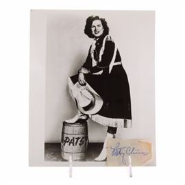 Patsy Cline Cut Signature with Photo COA: A Patsy Cline cut signature. Patsy’s signed her name with a blue ballpoint pen. The signature appears on a piece of paper; there is printing on the back of the paper, her signature is on the unprinted side. Her signature was authenticated by JSA; due to the small size of the paper, their sticker is on a full letter, not on the item. The JSA letter provides a picture of the signature. A contemporary unsigned black-and-white promotional photo of Patsy wearing a western outfit is enclosed. Patsy’s career started in the 1950s, she died tragically in a plane crash in 1963. To date, she’s still one of the most loved country/pop vocalists in the music industry.