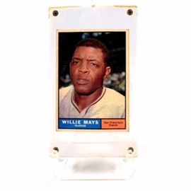 1961 Willie Mays Topps Baseball Card: A 1961 (HOF) Willie Mays San Francisco Giants Topps baseball card. This card depicts a close-up image of this legendary hitter. The card is #150 in the 1961 set and is housed in a thick screw down protective case. Willie is a member of the National Baseball Hall Of Fame and hit over “700” home runs during his illustrious career.