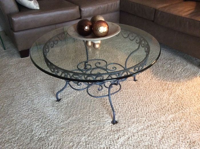 Glass and wrought iron round coffee table