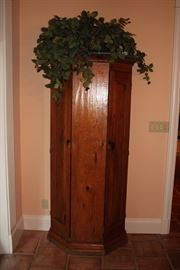 Wood Cabinet and Decorative Foliage