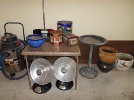 the garage has lots of small patio tables, planter pots & misc items - the two heat lamps & bird bath have sold