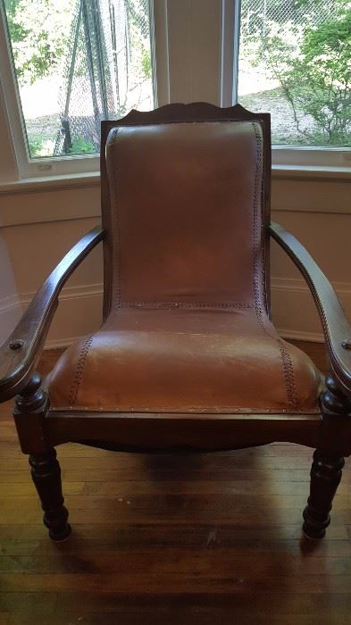 Very unusual leather chair with pull out features. 