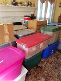 Containers being unpacked filled with all types holiday collectibles