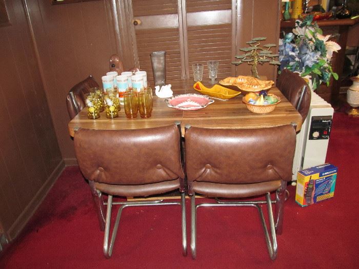 Cute table & chairs.  Chairs are in great shape, table needs a bit of work on the base.