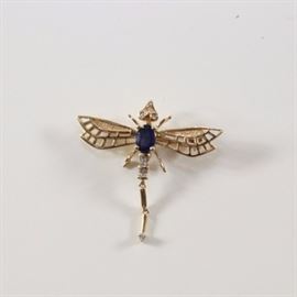 14K Diamond and Sapphire Dragonfly Pin: A 14K yellow gold dragonfly pin with a blue sapphire body and diamond accents.