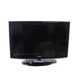 Samsung LCD Television: A Samsung LCD television, model LN32B360C5DXZA and version SG05. It has a black plastic frame around the screen, which measures approximately 31.5". An oval black stand, and remote control are included.