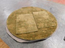 5 foot round area rug with two  3 by 2  matching entry pieces