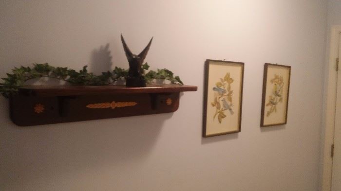 Wall shelf, statues and pictures
