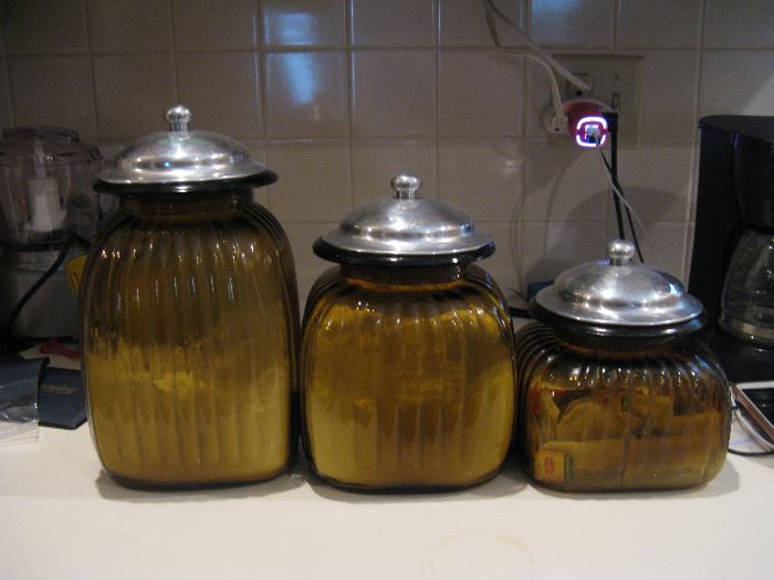 Vintage Glass canister set with silver lids