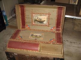 Inside of vintage trunk with amazing pictures