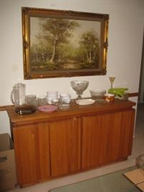 Retro sleek line buffet and large landscape picture