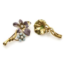 Pair of 14K Yellow Gold Seed Pearl and Enamel Flower Pins: A pair of 14K yellow gold flower pins each to feature a climbing stem, colored enamel and seed pearl accents.