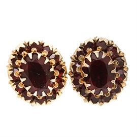 10K and 14K Yellow Gold Glass Stud Earrings: A pair of 10K yellow gold pierced stud earrings having a center red glass stone with a red glass halo surround and 14K yellow gold ear nuts.