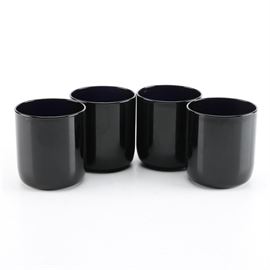 Libbey Glass Tumblers: A set of Libbey glass tumblers. This is a set of four dark blue glass tumblers. They are marked on the underside “L.”