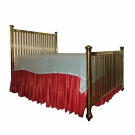 Vintage Full Size Brass Bed: A vintage brass bed frame. This classic piece has a hollow brass frame with vertical rails to the headboard and coordinating footboard. The frame includes side rails. The mattress and bedding pictured are not included with this item.