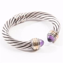 David Yurman Sterling Silver, 14K Yellow Gold, and Amethyst Cable Cuff: A sterling silver cable cuff with 14K yellow gold detailing and amethyst endcaps by David Yurman.