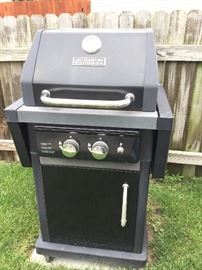 small gas grill shows some interior wear