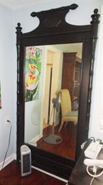 Giant full wall mirror in wood frame and stands upright on floor and no need to hang it. 82 inches tall x 44 wide