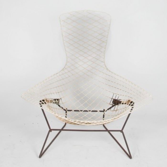 Mid Century Moder "Bird" Wire Chair Frame by Harry Bertoia: A Mid Century Modern Harry Bertoia Bird wire chair frame. The chair features a white metal mesh base in a bird wire design with low basket shaped seat, flared sides, and bird tail shaped backrest. The chair stands on two welded wire box-shaped legs. There are no visible maker’s marks or labels on this piece.