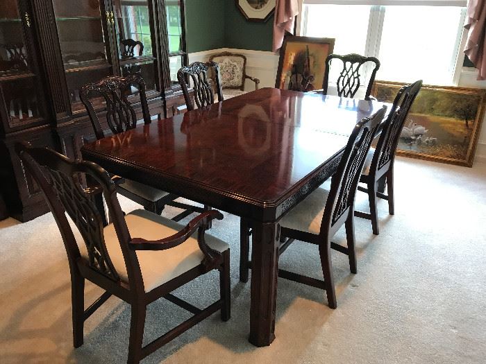 Pristine dining room set. Includes table (76"L x 46"W), 2 leaves (21"W), 6 chairs (2 arm, 4 armless), & pads Can be purchased prior to sale for asking price of $3800.00