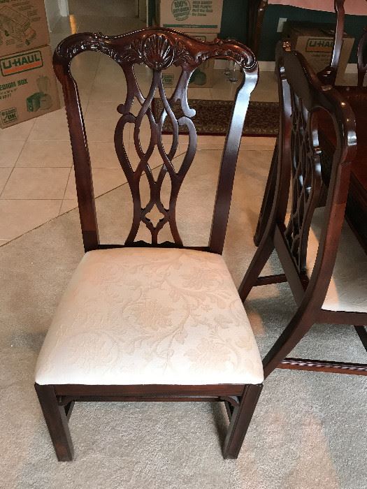One of four armless chairs