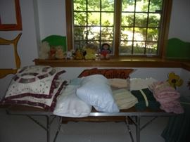 Many more linens not being shown yet. Cabbage Patch Dolls in background.