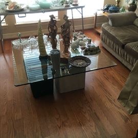 Glass top coffee table with stone base