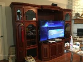 Cherry entertainment center with 65 inch Sony TV