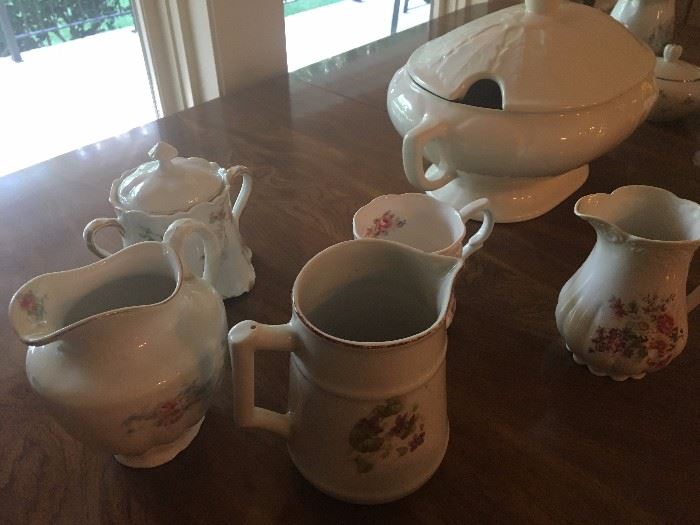 An assortment of creamers and sugar bowls