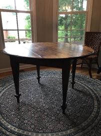 one of a kind, round dining table purchased from Bennett Galleries, made from reclaimed wood