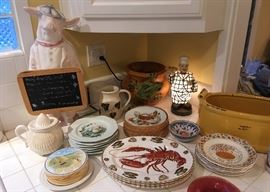 Plates for Appetizers, French Tarts, Fruit and Cheese, Lobster, and Pig with a Menu Blackboard