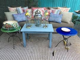 Luxury Outdoor All-weather Wicker Sofa with Colorful Throw Pillows and Occasional Tables