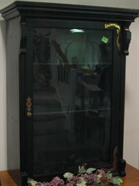 Wall cabinet with glass shelves painted black