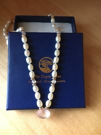 Fresh water pearls with aquamarine faceted beads and gold rondells. Pendant is rose quartz. The Lapis Tree in Cohasset, MA