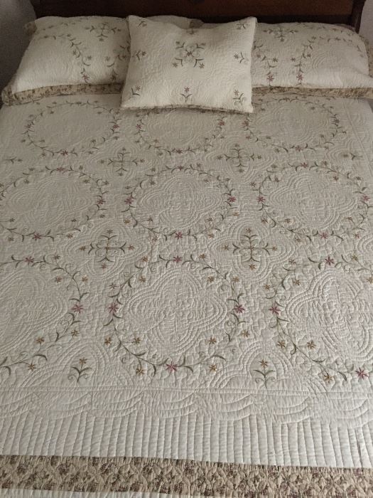 Embroidered coverlet and pillows