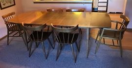 Vintage Paul McCobb Planner Group dining set.  Includes 4 side chairs, two captains chairs & 3  leaves.  Expands from 23 1/4" at its smallest to 88 1/2".  40" wide.