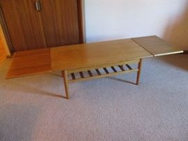 Danish Modern expandable coffee table.  Expands from 41 1/2" to 73" fully extended.  21 1/2" wide