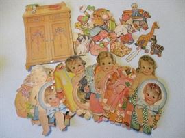 1930's Dionne quintuplets paper doll set.  The fifth is hiding. 